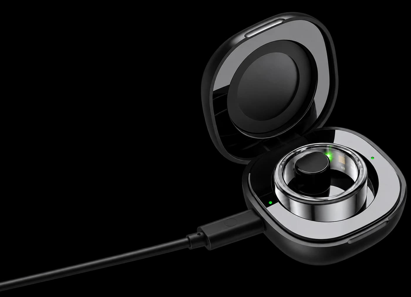 The charging box open with the silver Ohm Ring inside and the cable attached